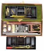 Three shotgun, rifle or pistol cleaning kits, one to suit 12 bore and .410 in fitted wooden box.
