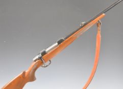 CZ 550 .243 bolt-action rifle with chequered semi-pistol grip and forend, leather sling,