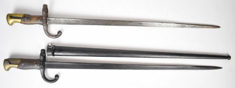 Two French Gras 1874 pattern bayonets, both with wooden grips, one dated 1880, longest blade 52cm,