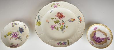 Meissen cabinet plate and two saucers with floral decoration, largest diameter 28cm
