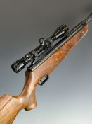 Theoben .22 air rifle with textured semi-pistol grip and forend, raised cheek piece, sound moderator