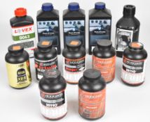 Twelve bottles of shotgun cartridge re-loading powder including Vihta Vuori Premium Smokeless