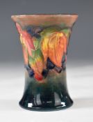 Moorcroft flambé flared vase decorated in the Leaf and Berry pattern, H9cm