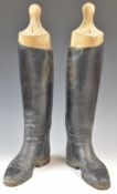 Pair of black leather riding boots with wooden trees, probably size 9