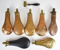 Seven various powder flasks including Sykes, Dixon & Sons and G&JW Hawksley, some copper with