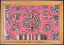 Rifle cartridge display board decorated with various brass cased rifle cartridges of various