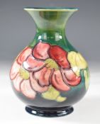 Moorcroft pedestal vase decorated in the Anemone pattern, with paper label to base, H13cm