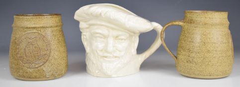 Two Oldham pottery 'I'm a War School Mug' tankards and a Royal Doulton white Sir Francis Drake
