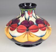 Moorcroft squat pedestal vase decorated in the Violets pattern, H11cm