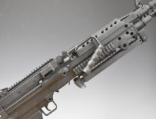 Cybergun FN Herstal Minimi 6mm machine gun airsoft rifle with detachable stock, textured pistol