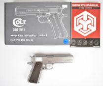 Cybergun Colt 1911 6mm CO2 airsoft pistol with chequered faux wooden grips, multi-shot magazine