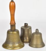 British WW2 ARP alarm bell with wooden handle together with two other bells, one marked J.P & Co