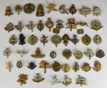 Approximately forty five cap badges including Artist's Rifles, Worcestershire Regiment, Cameron