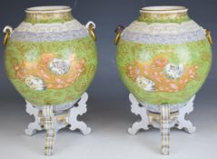 Pair of 19thC vases on stands with Chinese enamelled and relief moulded decoration, height on stands