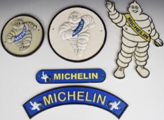 Five vintage style Michelin / Bibendum Michelin Man cast metal advertising signs, tallest 34cm