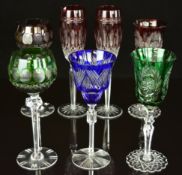Seven flash overlaid cut glass drinking glasses including a pair of Waterford Crystal Champagne