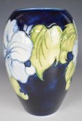 Moorcroft vase decorated in the Blue Hibiscus pattern, H18cm