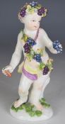 18thC Meissen style putti adorned with a grapevine, height 13cm
