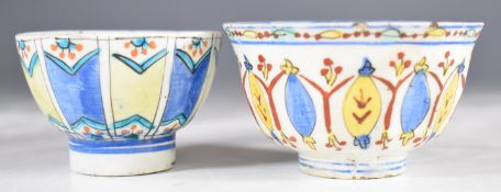 Two 18thC Turkish Kutahya polychrome decorated tea bowls, tallest 5cm