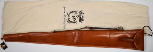 Leather shotgun or rifle slip with wool lining, 133cm long, in dust bag.