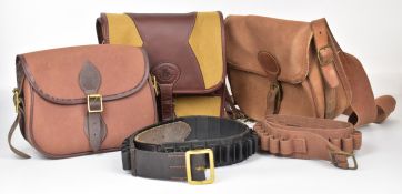 Four canvas and leather shotgun cartridge bags and belts including one larger loader's or similar