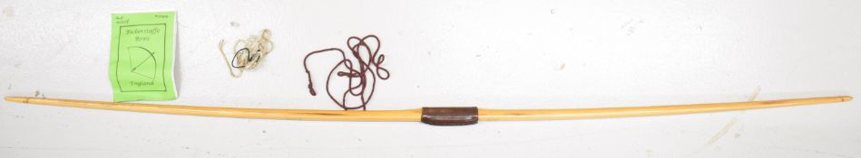 Bickerstaffe wooden longbow with leather grip, 194cm long, with original booklet and related