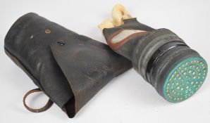 WW2 home front gas mask dated 1942, size small with a leather 'Scottie Dog' holder