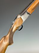Miroku 12 bore over and under ejector shotgun with engraved locks, chequered semi-pistol grip and