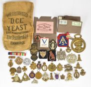 A collection of military badges including Cameron Highlanders, Royal Irish Fusiliers, Royal Armoured