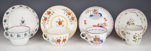 Four New Hall teacups and saucers, all florally decorated, tallest 6.5cm