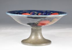 Moorcroft and Tudric pewter Arts & Crafts tazza decorated in the Pomegranate pattern, diameter