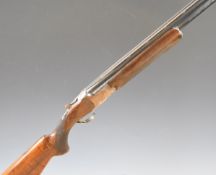 Miroku 12 bore over and under ejector shotgun with engraved locks, trigger guard, thumb lever and