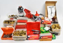 A collection of rifle or shotgun cartridge re-loading equipment including Lee Challenger Press
