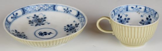 Meissen 18thC cup and saucer with ribbed outer decoration and blue and white floral decoration
