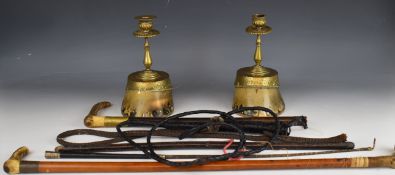 Riding crops and whips including Swaine and a pair of taxidermy interest horse hoof candlesticks,