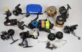 Collection of fixed spool reels and a wide spool centrepin, including Okuma Chaser, Mitchell 314,