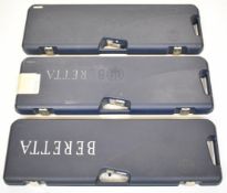 Three Beretta shotgun cases, all with fitted interiors for an over and under shotgun and coded