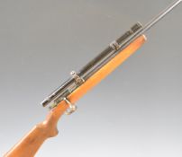 Winchester Model 69 .22 bolt-action rifle with semi-pistol grip, military style scope and 25 inch