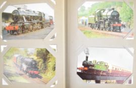 Approximately one hundred and fifty steam locomotive postcards, mainly preservation era, in a blue