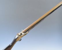 Unnamed 10 bore flintlock muzzle loading gun with engraved lock, trigger guard and butt plate and