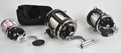 Three Okuma multiplier fishing reels including big game shark / tuna Titus T50L, Convector CV55L and