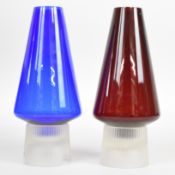 Two Per Lutken for Holmegaard Hygge tea light holders / lamps, one red and one blue, both with clear