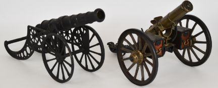 Two model desk or signalling guns, one a Gatling gun with moving parts the other with11.5 inch