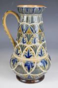 Doulton Lambeth art pottery ewer with incised monogram FEL and 1877 to base, H22cm