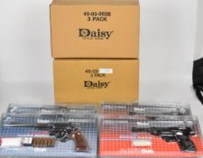 Six Daisy Model 57 airsoft revolvers and Model 38 airsoft pistols, all sealed in original packaging.