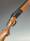 Valmet 12 bore over and under shotgun with engraved locks and underside, chequered semi-pistol