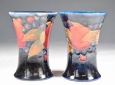 Moorcroft pair of flared vases decorated in the Pomegranate pattern, both signed to bases, H9cm