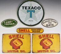 Seven vintage style cast iron and tin plate signs including Land Rover, Shell Motor Spirit, Texaco