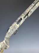 Mossberg Model 500 12 bore 3-shot pump-action shotgun with Advantage Max-4 finish, chequered semi-