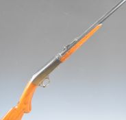 Browning .22 short semi-automatic rifle with semi-pistol grip, adjustable sights and 19 inch barrel,